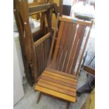 A set four teak folding garden chairs