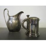 A George V silver cream jug with strap handle and reeded rim, London 1926 makers S W Smith & Co