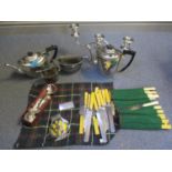 A four-piece silver plated tea set, mixed silver plate to include a candelabra, cutlery and a