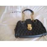 A Jaeger black quilted leather shoulder bag with chain and leather shoulder straps, gilt hardware