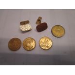 A pair of yellow metal cuff links, 8g, three To Hanover tokens and a Georgian gilt brass token