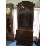 A 19th century mahogany display cabinet above a chest of four graduating drawers, with key Location: