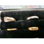 Two 22ct gold wedding bands, 750 (18ct) white gold band and a 9ct tri coloured gold ring