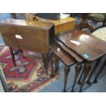 A nest of reproduction mahogany table on ball and claw feet, together with an early 20th century