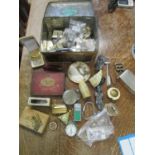 A mixed lot of lighters, coins, Sekonda pocket watch and other items, all in a vintage tin