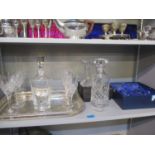 A pair of Czechoslovakian candlesticks, two decanters, wine glasses and a silver plated tray