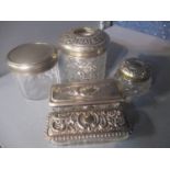 A selection of silver topped dressing table items to include a jar having a machine turned lid