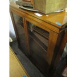 A Victorian oak glazed, two door bookcase, standing on a plinth base, 43" h x 42"w