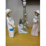 A Lladro figural table lamp, and two Nao figurines