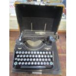 A continental 340 typewriter in a case