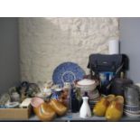 Miscellaneous items to include a blue and white charger, vintage glass and pottery bottles, clogs,