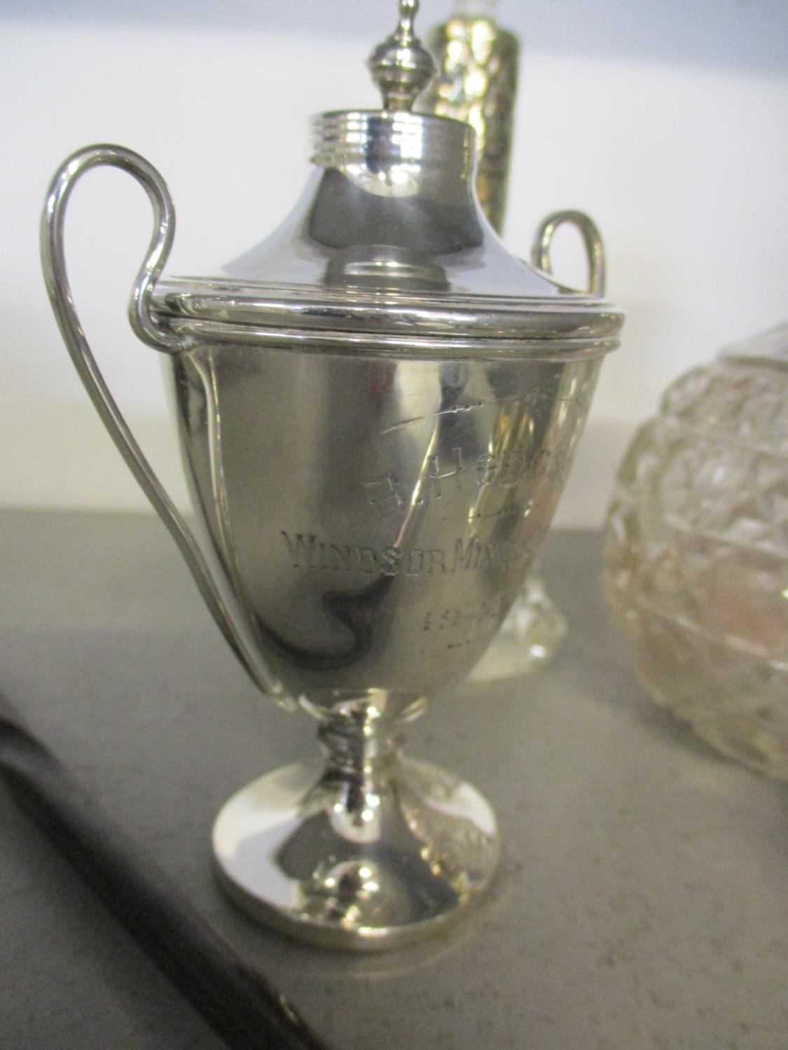 Two silver topped dressing table bottles, a silver trophy, a silver napkin ring and a white metal - Image 2 of 3