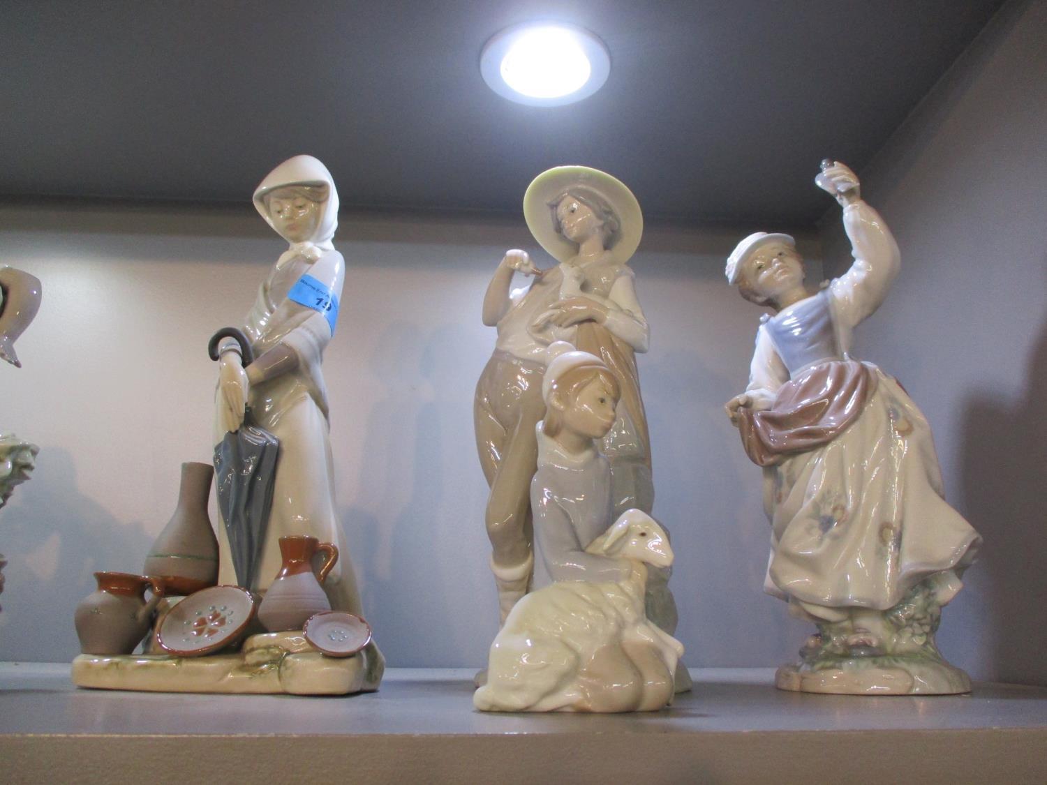Seven Lladro figures to include a young boy playing a drum - Image 2 of 3