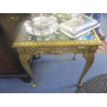 A small mirrored and gilt ornate occasional tables on cabriole legs