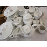 A Royal Doulton Tumbling leaves dinner service having white ground with autumnal leaf design