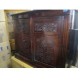 A late Victorian mahogany two door carved side cabinet, 36" h x 42 1/2"w