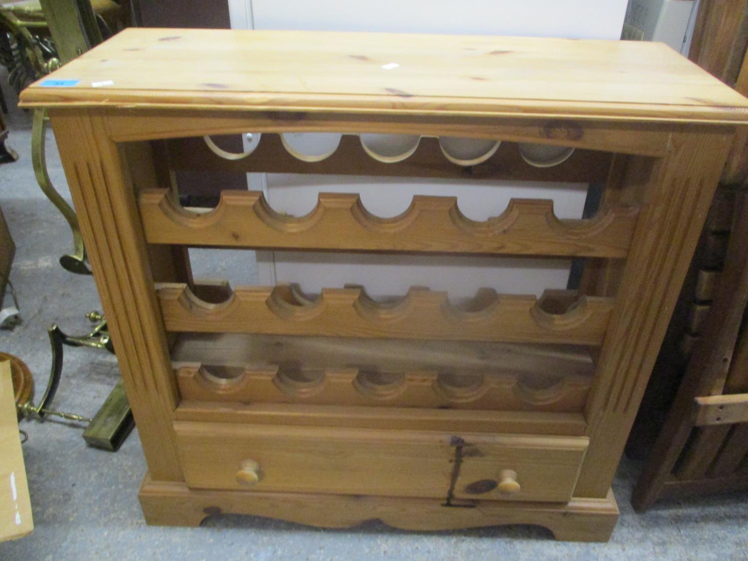 A modern pine wire rack with single drawer below, 30 1/4" h x 31 1/4"w