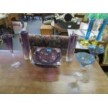 A selection of coloured Waterford table glass to include an amethyst cut glass bowl, two vases and a