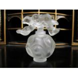 A Lalique Falcon Nuages frosted glass scent bottle, the round bottle moulded with cloud motifs,