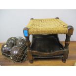 Four vintage bowls in a net, together with an oak framed rattan stool with lower tier