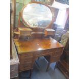 A late 19th/early 20th century burr dressing table having a swing mirror flanked by two small