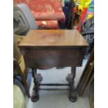 A Victorian rosewood side table with a drawer on lyre shaped ends and turned feet