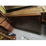 A 1920s oak sideboard with raised back, panelled doors and cabriole legs