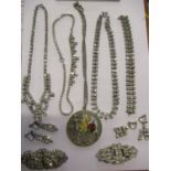 A quantity of vintage costume jewellery to include silver items including an Art Nouveau silver