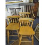 Three modern pine bar stools, a foot stool and two Windsor style chairs, together with a mid 20th