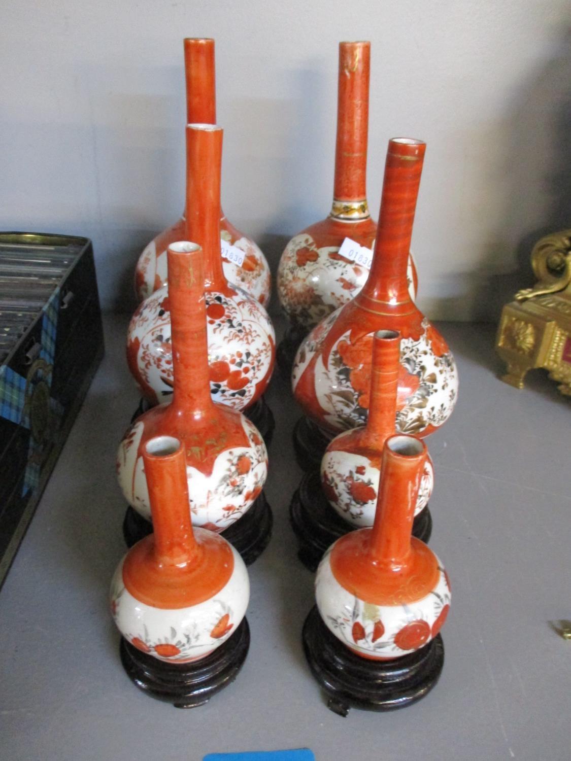 Eight Kutani specimen vases and stands A/F