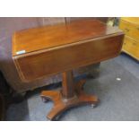 An early 20th century mahogany drop leaf work table