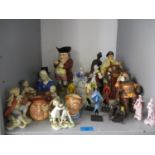 A quantity of figures and character jugs to include Royal Doulton