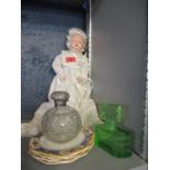 A German painted wooden jointed doll, a silver topped scent bottle, an Art Deco green scent and a