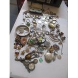 Mixed costume jewellery to include a silver locket, bracelet, tigers eye inset necklace and other