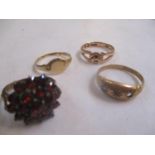 Four 9ct gold rings to include a garnet cluster ring