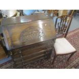 A mid 20th century oak bureau together with an early 20th century mahogany bedroom chair