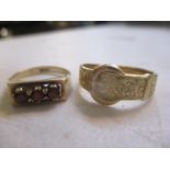 Two 9ct gold rings to include a three stone garnet inset ring