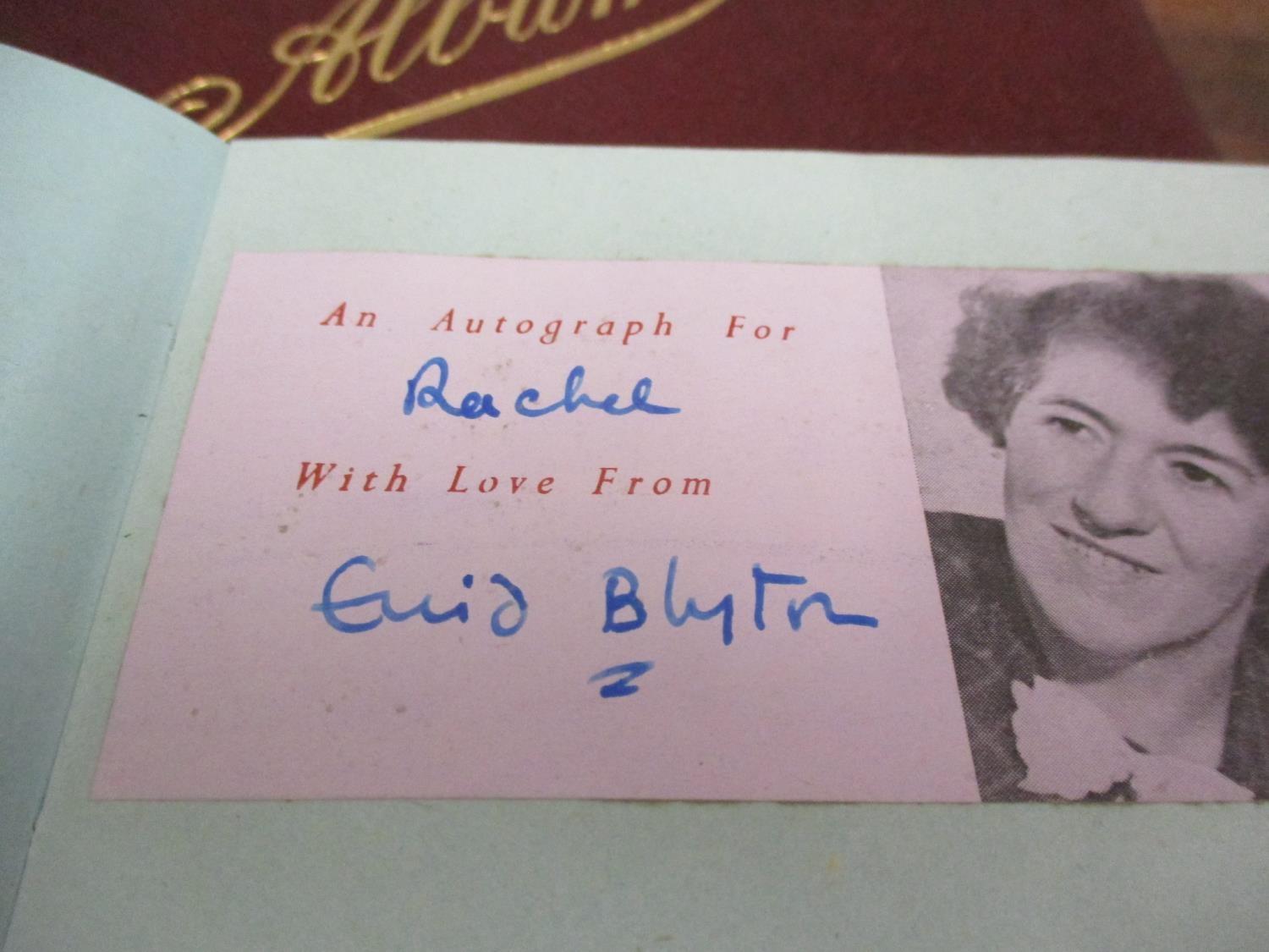 An autograph book, mid 20th century containing Enid Blyton's signature and various Olympians,