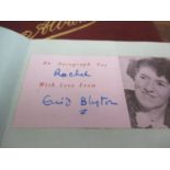 An autograph book, mid 20th century containing Enid Blyton's signature and various Olympians,