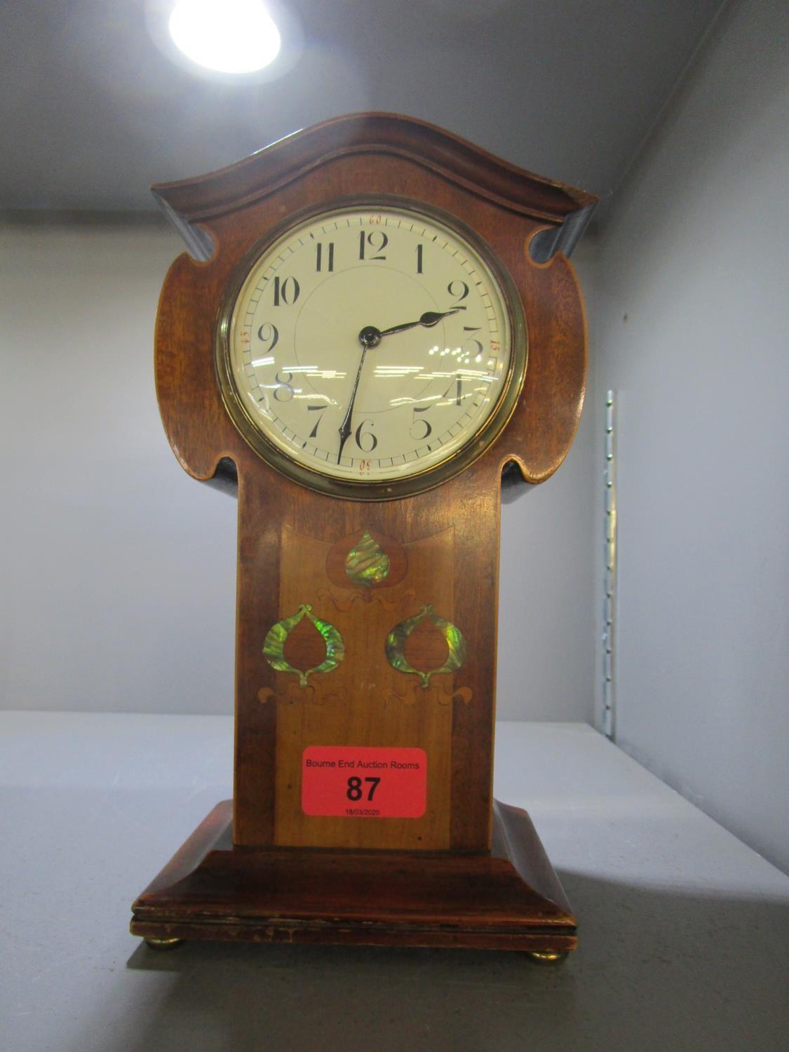 An Edwardian inlaid mahogany Art Nouveau cased mantle clock, inlaid amboyna flower bud decoration,