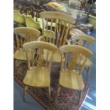 Five modern country style beech kitchen chairs comprising a set of four, with a pierced splat and an