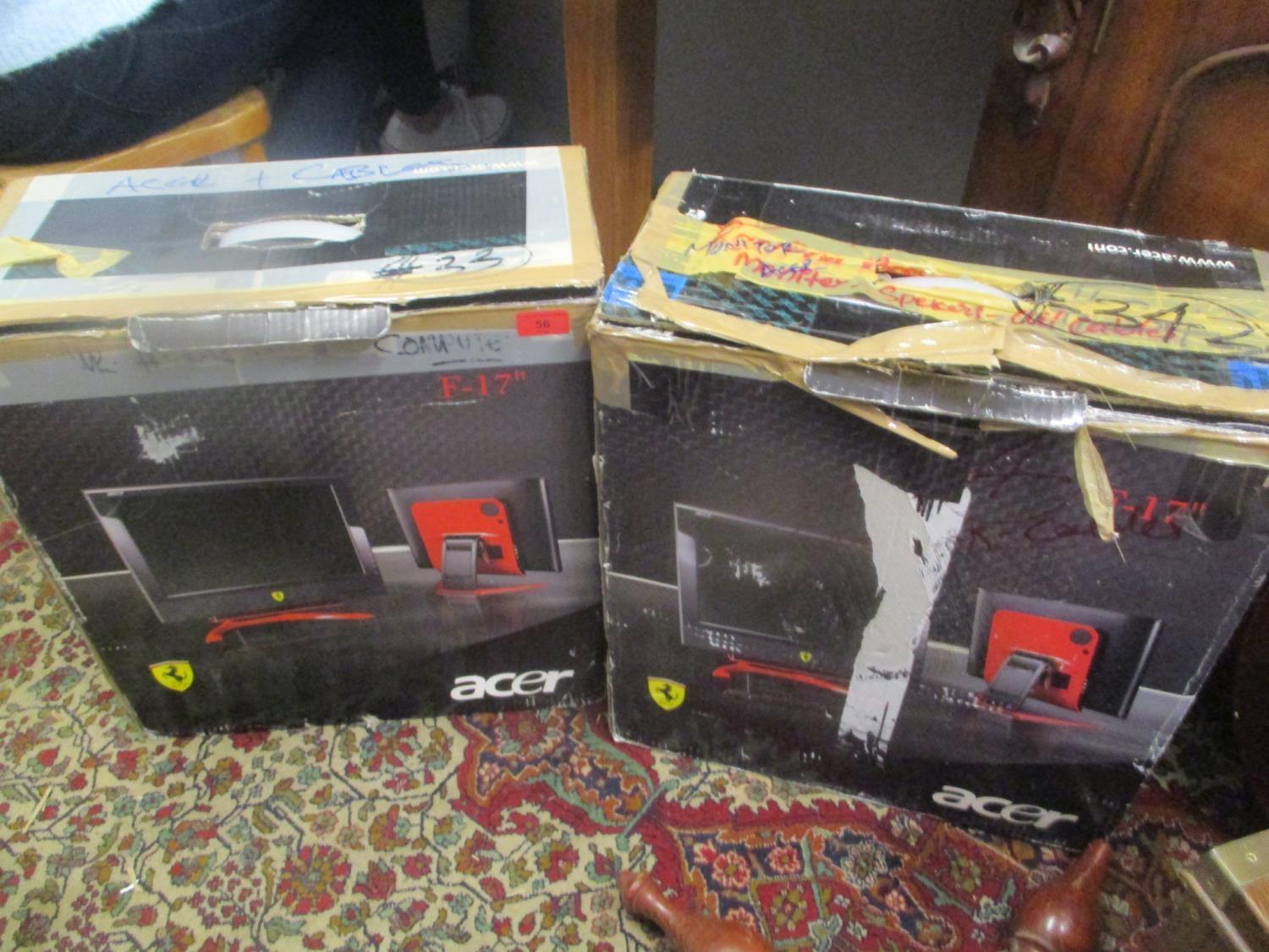 Two boxed Acer F-17 screen monitors