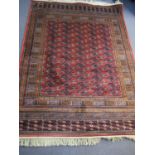 A Pakistan Bokhara pink ground machine made rug 67" x 49" Location: SR