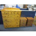A modern pine chest of four long and three short drawers, together with two bedside drawers