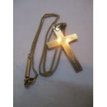 A 9ct gold cross on a 9ct gold necklace