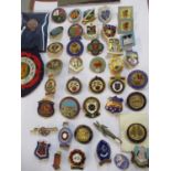 A collection of retro enamelled badges, to include Masonic and bowling badges, together with a cloth