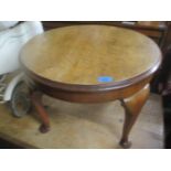 A 1920s walnut circular coffee table on cabriole legs, together with a Victorian style mahogany