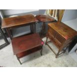 An oak work cabinet with hinged top above two drawers on barley twist legs united by square