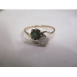 A 9ct gold diamond and tourmaline crossover ring