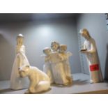 Three Lladro figures and one similar, together with a Lladro model of a polar bear cub
